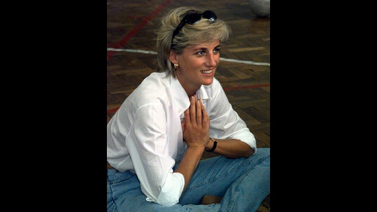 Princess of Wales, sits and talks to members of a Zenica volleyball team who have suffered injuries from mines, during her visit to Zenica, Bosnia. She believed in fashion classics for those informal minimalist looks. A white shirt with mommy jeans and gold earrings does the trick here. (AP) Princess of Wales, sits and talks to members of a Zenica volleyball team who have suffered injuries from mines, during her visit to Zenica, Bosnia. She believed in fashion classics for those informal minimalist looks. A white shirt with mommy jeans and gold earrings does the trick here. (AP)