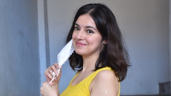 Divya Khosla Kumar removes her maks for photos.