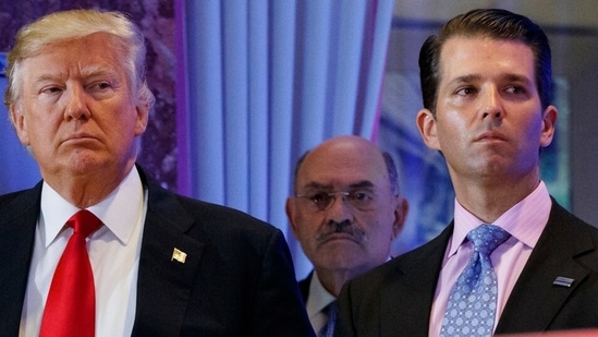 This file photo from Wednesday, Jan. 11, 2017, shows Donald Trump, left, his chief financial officer Allen Weisselberg, center, and his son Donald Trump Jr., right, during a news conference at Trump Tower in New York. (AP Photo/Evan Vucci, File)