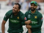 Wahab Riaz (L) with Mohammad Hafeez (R)