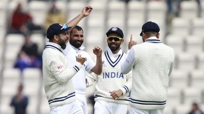 India's captain Virat Kohli, left, and Mohammed Shami, second left, celebrate with teammates (HT_PRINT) India's captain Virat Kohli, left, and Mohammed Shami, second left, celebrate with teammates (HT_PRINT)