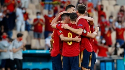 Spain's Alvaro Morata celebrates scoring their first goal with teammates (Pool via REUTERS)
