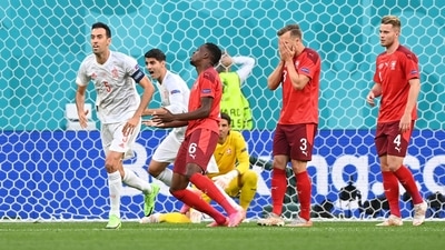 Switzerland's Denis Zakaria reacts after he scores an own goal and the first for Spain. (Pool via REUTERS)