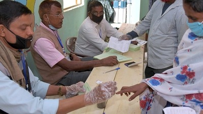 Polling official inks the finger of a voter (ANI/For Representative Purposes) Polling official inks the finger of a voter (ANI/For Representative Purposes)