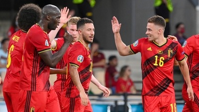 Belgium's Thorgan Hazard, right, celebrates with teammates after scoring his team's first goal during the Euro 2020 soccer championship round of 16 match. (AP)