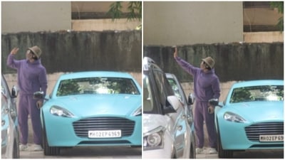 Ranveer Singh with his aqua blue Aston Martin car.