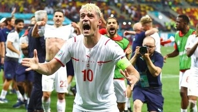 Switzerland's Granit Xhaka celebrates end of the Euro 2020 soccer championship round of 16 match between France and Switzerland at the National Arena stadium, in Bucharest, Romania. (AP) Switzerland's Granit Xhaka celebrates end of the Euro 2020 soccer championship round of 16 match between France and Switzerland at the National Arena stadium, in Bucharest, Romania. (AP)