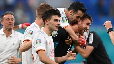 Spain's goalkeeper Unai Simon celebrates with teammates after saving a penalty during the Euro 2020 soccer championship quarterfinal match. (AP) Spain's goalkeeper Unai Simon celebrates with teammates after saving a penalty during the Euro 2020 soccer championship quarterfinal match. (AP)