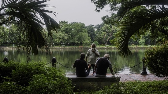 Visitors in a park that is open between 6 and 9 am to people that have received a Covid-19 vaccine, at Rabindra Sarovar Lake in Kolkata on June 22. India added 100,000 deaths in 39 days, a Reuters tally showed, as a brutal second wave of infections swept across cities and into the vast countryside where millions remain vulnerable without a single shot of vaccines.(Arko Datto / Bloomberg)