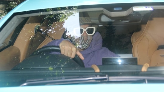 Ranveer wore huge white shade with black lenses as he got into his fancy ride which according to multiple reports costs around Rs. 3.29 crores.(Varinder Chawla)