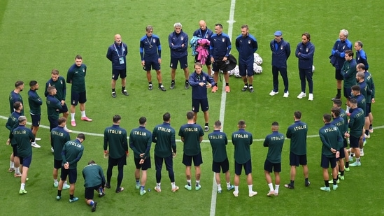 Italy's manager Roberto Mancini briefs players during a training session ahead of Friday's Euro 2020 soccer championship round of 8 match against Belgium,.(AP)
