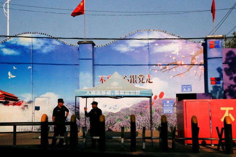 File photo of security guards standing at the gates of what is officially known as a vocational skills education centre in Huocheng County in Xinjiang Uighur Autonomous Region, China. (Reuters Photo)