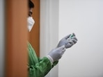 A Trinamool Congress leader in West Bengal allegedly administered the Covid-19 vaccine to a woman at a government vaccination camp in Asansol(AFP/Representative Image) A Trinamool Congress leader in West Bengal allegedly administered the Covid-19 vaccine to a woman at a government vaccination camp in Asansol(AFP/Representative Image)