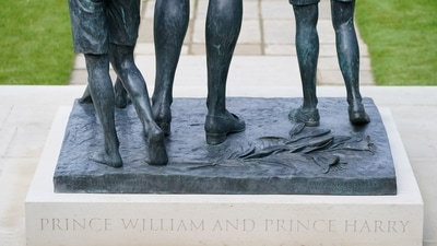 Detail of the inscription 'Prince William and Prince Harry' is pictured on the the statue of Britain's Princess Diana ahead of the first members of the public being allowed in to view it in the Sunken Garden at Kensington Palace, London, Britain July 2, 2021.  (REUTERS)