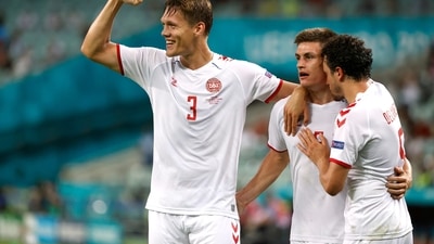 Soccer Football - Euro 2020 - Quarter Final - Czech Republic v Denmark - Baku Olympic Stadium, Baku, Azerbaijan - July 3, 2021 Denmark's Jannik Vestergaard, Thomas Delaney and Joakim Maehle celebrate their second goal scored by Kasper Dolberg Pool via REUTERS/Valentyn Ogirenko (Pool via REUTERS)