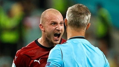 Soccer Football - Euro 2020 - Quarter Final - Czech Republic v Denmark - Baku Olympic Stadium, Baku, Azerbaijan - July 3, 2021 Czech Republic's Michael Krmencik reacts towards referee Bjorn Kuipers after being shown a yellow card Pool via REUTERS/Valentyn Ogirenko (Pool via REUTERS)