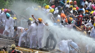 Punjab Police use water cannon on AAP leaders and supporters during a protest march towards Punjab Chief Minister Capt Amrinder Singh’s Farm House, at Siswan T Point, near Chandigarh, (Ravi Kumar/Hindustan Times) Punjab Police use water cannon on AAP leaders and supporters during a protest march towards Punjab Chief Minister Capt Amrinder Singh’s Farm House, at Siswan T Point, near Chandigarh, (Ravi Kumar/Hindustan Times)
