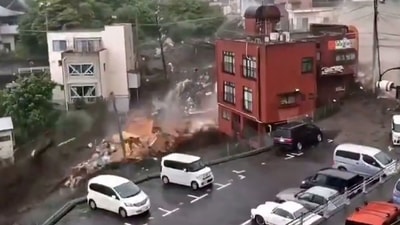 Screengrab from handout video released by a local resident on July 3 shows a mudslide that hit a residential area in Atami, Shizuoka Prefecture, Japan. Shizuoka Gov. Heita Kawakatsu told reporters that the Coast Guard had discovered two people who had been washed into the sea by the mudslide. (Kyodo via REUTERS) Screengrab from handout video released by a local resident on July 3 shows a mudslide that hit a residential area in Atami, Shizuoka Prefecture, Japan. Shizuoka Gov. Heita Kawakatsu told reporters that the Coast Guard had discovered two people who had been washed into the sea by the mudslide. (Kyodo via REUTERS)