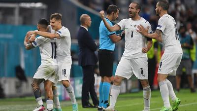 Italy's Lorenzo Insigne celebrates scoring their second goal with Nicolo Barella, Giorgio Chiellini and Leonardo Bonucci as Belgium coach Roberto Martinez looks on. (Pool via REUTERS) Italy's Lorenzo Insigne celebrates scoring their second goal with Nicolo Barella, Giorgio Chiellini and Leonardo Bonucci as Belgium coach Roberto Martinez looks on. (Pool via REUTERS)