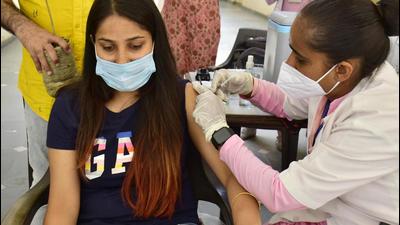 A youngster being injected the Covid-19 vaccine in Amritsar on Saturday. (Sameer Sehgal/HT)