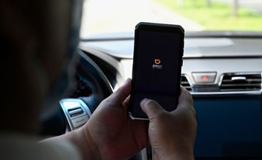 A driver opens the Didi Chuxing ride-hailing app on his smartphone in Beijing. ( AFP) A driver opens the Didi Chuxing ride-hailing app on his smartphone in Beijing. ( AFP)