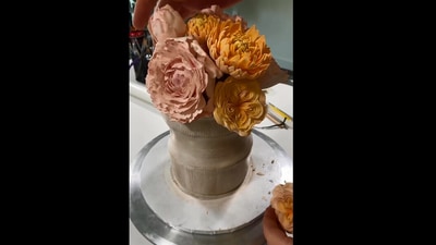 The image shows the cake, which looks like a bouquet of flowers, in process of being created. (Instagram/@lukevincentini)