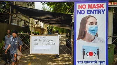 A notice on a gate states non availability of Covid-19 vaccines due to shortage of vaccine supplies in Mumbai, Thursday, July 1, 2021. (PTI) A notice on a gate states non availability of Covid-19 vaccines due to shortage of vaccine supplies in Mumbai, Thursday, July 1, 2021. (PTI)