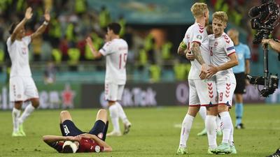 Denmark's players celebrate after winning the Euro 2020 soccer championship quarterfinal match against Czech Republic. (AP) Denmark's players celebrate after winning the Euro 2020 soccer championship quarterfinal match against Czech Republic. (AP)