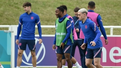 England's Phil Foden, right, and England's Raheem Sterling attend a training session at St George's Park. (AP) England's Phil Foden, right, and England's Raheem Sterling attend a training session at St George's Park. (AP)