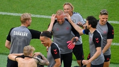 Denmark's goalkeeper Kasper Schmeichel, center, with players during a training session ahead of Saturday's Euro 2020 soccer championship quarterfinal match against Czech Republic. (AP)