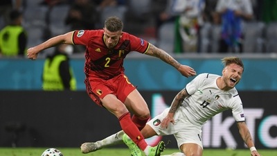Italy's Ciro Immobile, right, challenges for the ball with Belgium's Toby Alderweireld. (AP)