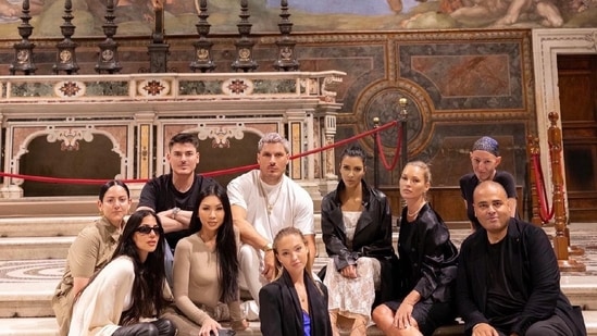 PHOTOS: Look During Kim Kardashian's Dress 7 And of course, in the photos she posted, she covered her revealing gown with a long leather jacket. (Instagram)