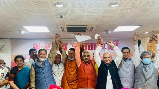Dhami with other party leaders in Uttarakhand. (HT photo)