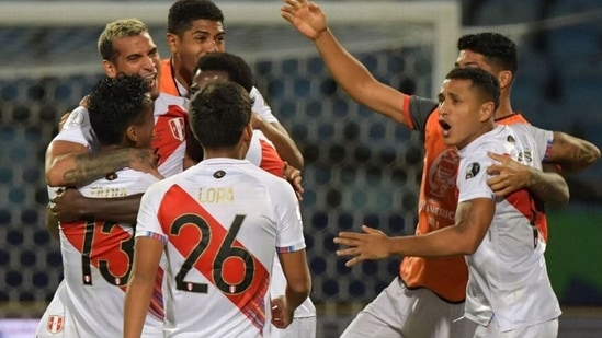 Peru players celebrate after beating Paraguay on penalties in the Copa America quarterfinals. (Getty Images)