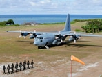 This April 21, 2017, file photo shows a Philippine Air Force C-130 transport plane as Philippine troops march at the Philippine-claimed Thitu Island off the disputed Spratlys chain of islands in the South China Sea in the western Philippines. (AP) This April 21, 2017, file photo shows a Philippine Air Force C-130 transport plane as Philippine troops march at the Philippine-claimed Thitu Island off the disputed Spratlys chain of islands in the South China Sea in the western Philippines. (AP)