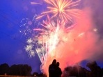 Carolina Carrasco and NYC Torunski, from Brattleboro, Vt., watch fireworks during the Hinsdale, N.H., Fourth of the July firework show on Saturday, July 3, 2021. (Kristopher Radder/The Brattleboro Reformer via AP) Carolina Carrasco and NYC Torunski, from Brattleboro, Vt., watch fireworks during the Hinsdale, N.H., Fourth of the July firework show on Saturday, July 3, 2021. (Kristopher Radder/The Brattleboro Reformer via AP)