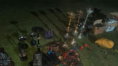 The raiding team recovered 14 hookahs, eight bottles of whiskey and scotch, and 132 bottles of beer in the hotel located on the Amritsar-Tarn Taran road. (HT Photo)