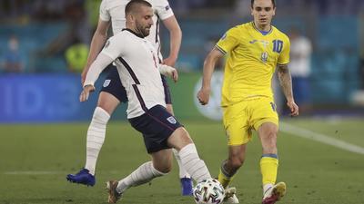 England's Luke Shaw, left, fights for the ball with Ukraine's Mykola Shaparenko during the Euro 2020 soccer championship quarterfinal soccer match between Ukraine and England at the Olympic stadium, in Rome, Italy, Saturday, July 3, 2021. (Lars Baron/Pool Photo via AP) (AP) England's Luke Shaw, left, fights for the ball with Ukraine's Mykola Shaparenko during the Euro 2020 soccer championship quarterfinal soccer match between Ukraine and England at the Olympic stadium, in Rome, Italy, Saturday, July 3, 2021. (Lars Baron/Pool Photo via AP) (AP)
