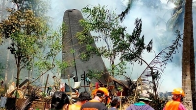 First responders work at the site after a Philippines Air Force Lockheed C-130 plane carrying troops crashed on landing in Patikul, Sulu province. (via Reuters)