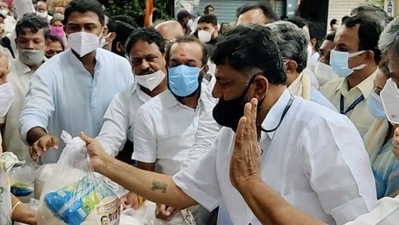KPCC President DK Shivakumar distributes ration kits to the needy people, at Malleshwaram in Bengaluru in this file photo. (ANI Photo) KPCC President DK Shivakumar distributes ration kits to the needy people, at Malleshwaram in Bengaluru in this file photo. (ANI Photo)