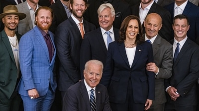US President Joe Biden and Vice President Kamala Harris, with the Los Angeles Dodgers during a ceremony at the White House on Friday. (Bloomberg Photo) US President Joe Biden and Vice President Kamala Harris, with the Los Angeles Dodgers during a ceremony at the White House on Friday. (Bloomberg Photo)
