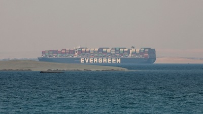 The vessel had run aground in the single-lane stretch of the canal before it was extracted six days later after a massive salvage effort. (AP) The vessel had run aground in the single-lane stretch of the canal before it was extracted six days later after a massive salvage effort. (AP)