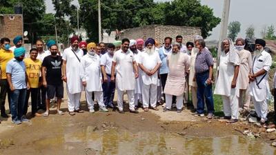 Cabinet minister Bharat Bhushan Ashu along with others inspecting Panj Peer Road in Ludhiana on Sunday. (HT PHOTO)
