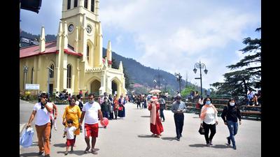 Tourists on The Ridge in Shimla on Sunday. (Deepak Sansta/HT) Tourists on The Ridge in Shimla on Sunday. (Deepak Sansta/HT)