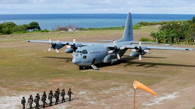 This April 21, 2017, file photo shows a Philippine Air Force C-130 transport plane as Philippine troops march at the Philippine-claimed Thitu Island off the disputed Spratlys chain of islands in the South China Sea in the western Philippines. (AP) This April 21, 2017, file photo shows a Philippine Air Force C-130 transport plane as Philippine troops march at the Philippine-claimed Thitu Island off the disputed Spratlys chain of islands in the South China Sea in the western Philippines. (AP)