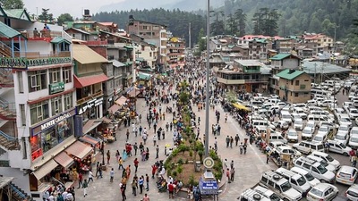Tourists visit the Mall Road afoter relaxation in Covid-19 curfew, in Manali. (PTI) Tourists visit the Mall Road afoter relaxation in Covid-19 curfew, in Manali. (PTI)