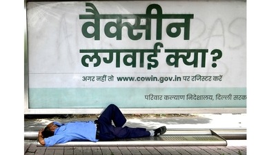 A man rests under a bus stand in New Delhi on July 1. 94 new coronavirus cases were reported in Delhi on July 4 – up from 86 a day ago – as its cumulative infection tally rose to 1,434,554, the health bulletin showed. (ANI ) A man rests under a bus stand in New Delhi on July 1. 94 new coronavirus cases were reported in Delhi on July 4 – up from 86 a day ago – as its cumulative infection tally rose to 1,434,554, the health bulletin showed. (ANI )