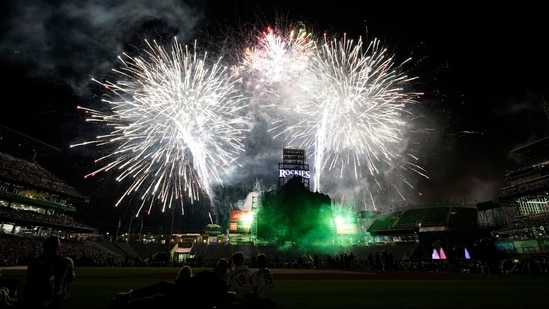 Fireworks light up over Coors Field to mark the Fourth of July holiday after a baseball game between the St. Louis Cardinals and Colorado Rockies on Friday, July 2, 2021, in Denver. (AP Photo/David Zalubowski)