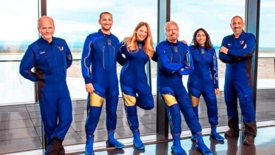 From left: Chief Pilot Dave Mackay, Lead Operations Engineer Colin Bennett, Chief Astronaut Instructor Beth Moses, Founder of Virgin Galactic Richard Branson, Vice President of Government Affairs and Research Operations Sirisha Bandla and pilot Michael Masucci. (AP)