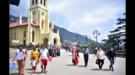 Tourists on The Ridge in Shimla on Sunday. (Deepak Sansta/HT)